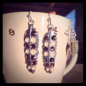 Beautiful feather earrings with rhinestone bling